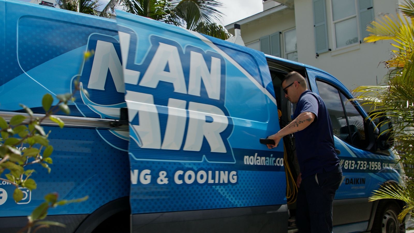 Air Conditioning Contractor in Carrollwood - FL inspecting a residential condenser during a cooling service visit