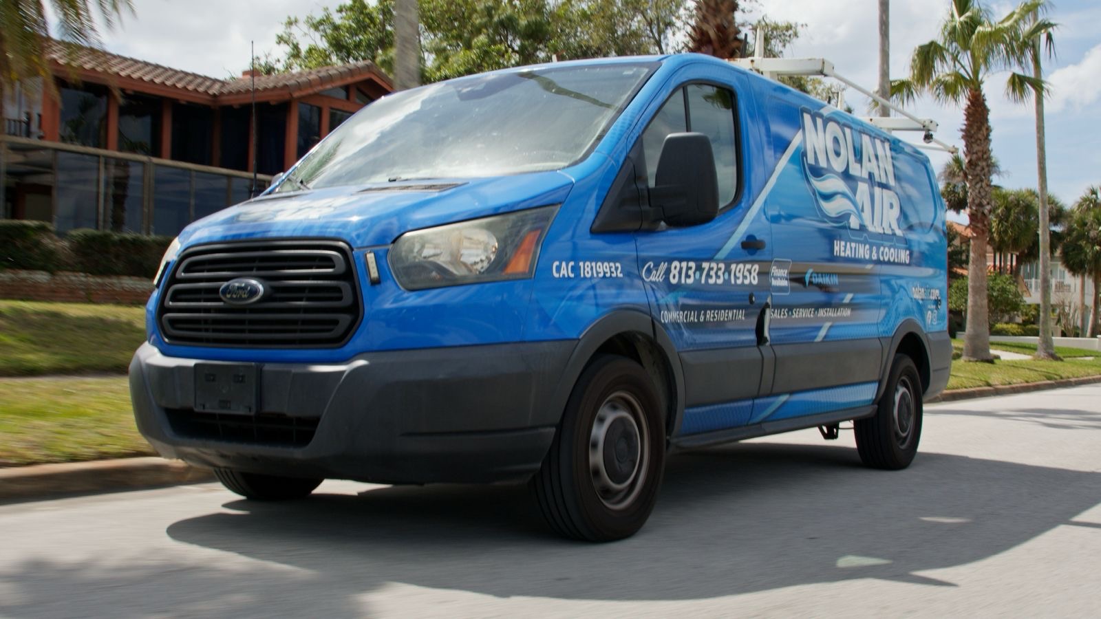 Air Conditioning Contractor testing indoor airflow in a Carrollwood - FL house with diagnostic equipment